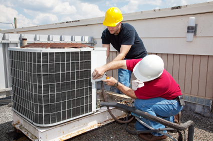 Airco Home Comfort Services - HVAC Contractors Working on a Roof Unit